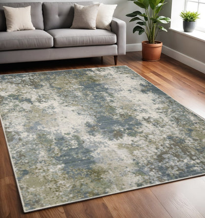 5' X 8' Blue Grey Green And Beige Abstract Power Loom Stain Resistant Area Rug