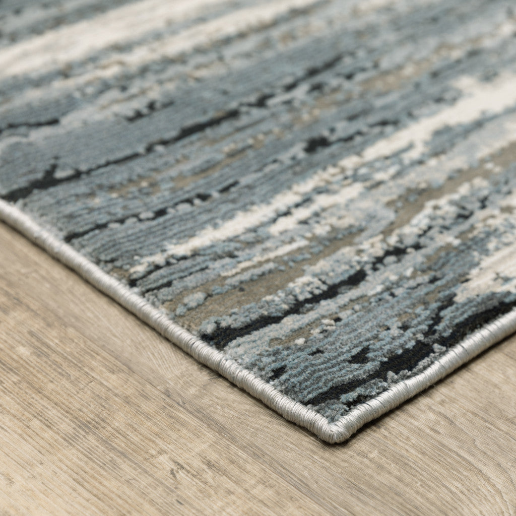 5' X 8' Blue Grey Beige And Brown Abstract Power Loom Stain Resistant Area Rug