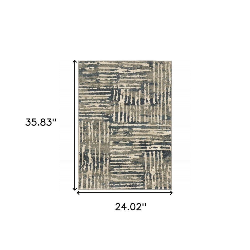 Rectangular area rug with abstract patchwork pattern in beige, gray and blue tones; 35.83" x 24.02