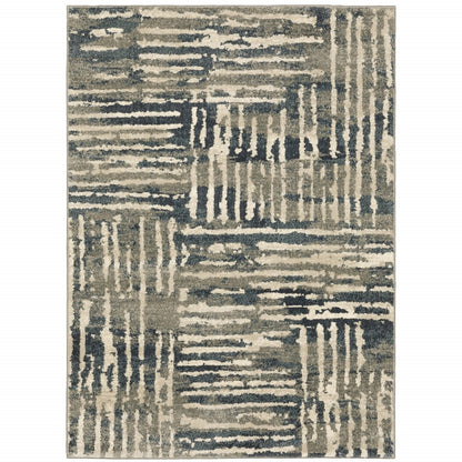 Rectangular abstract area rug with beige, gray and navy linear patterns for a modern, textured look.