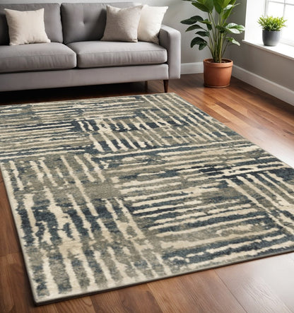 5' X 7' Blue And Beige Abstract Power Loom Stain Resistant Area Rug