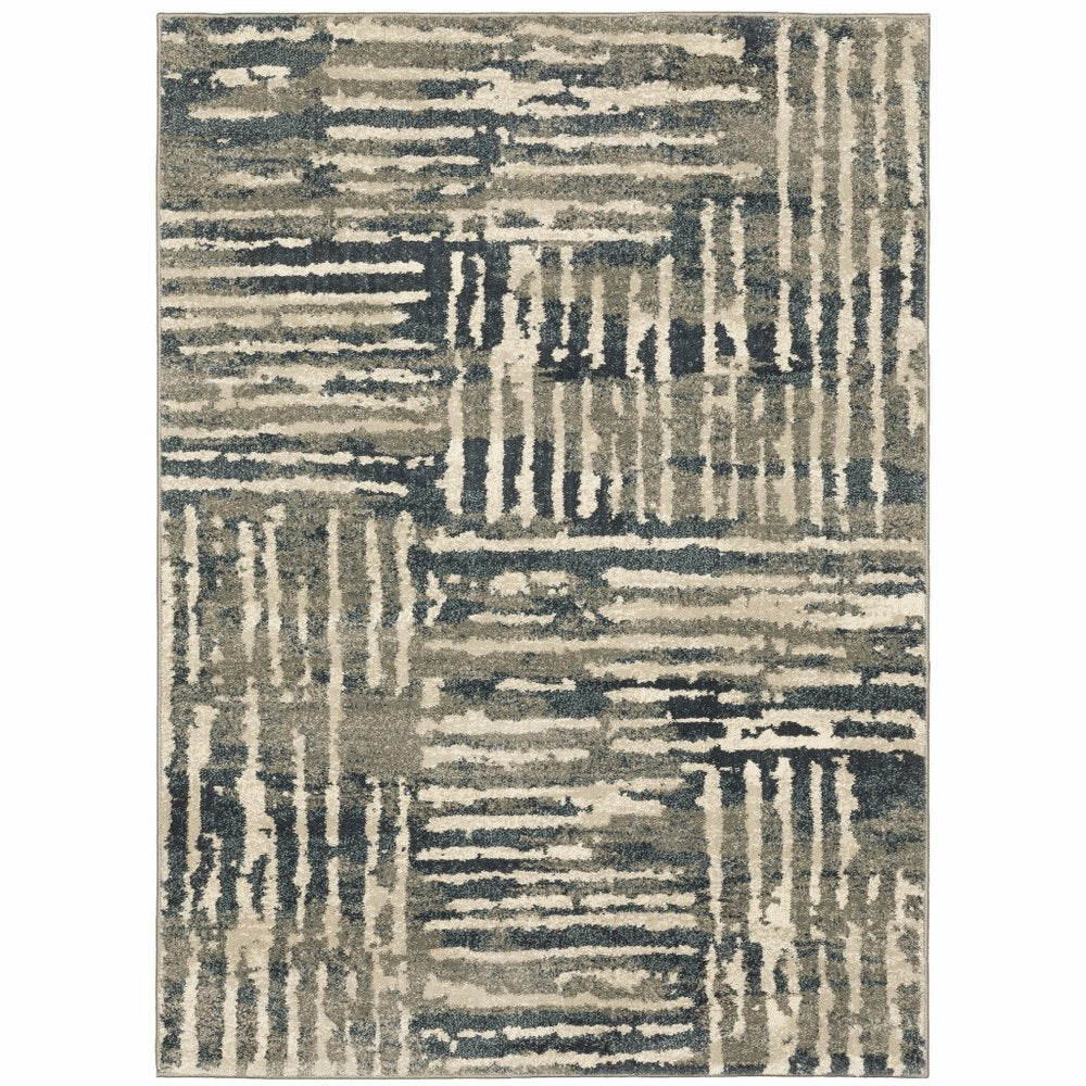 Abstract geometric area rug in muted blues, grays and beiges with linear stripe blocks; modern living room decor.