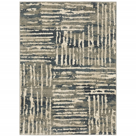 Abstract geometric area rug in muted blues, grays and beiges with linear stripe blocks; modern living room decor.