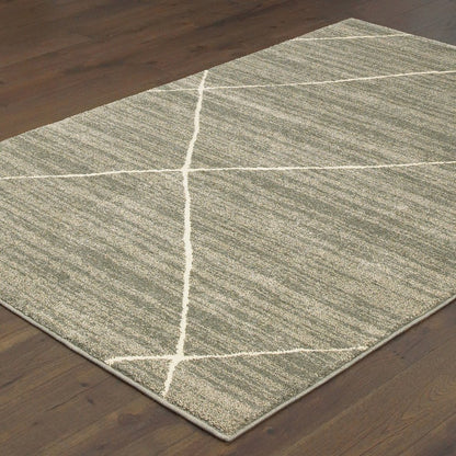 7' X 9' Gray And Ivory Geometric Shag Area Rug