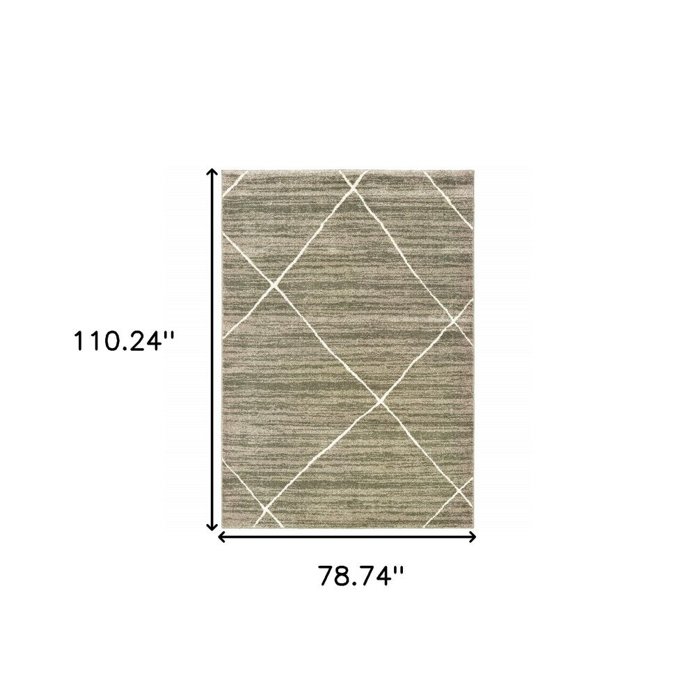 Rectangular gray and ivory geometric shag area rug, measuring 110.24" x 78.74".