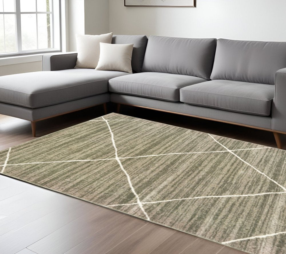 Gray and ivory geometric shag area rug, 7' x 9', on a dark wood floor.