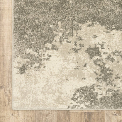 Rectangular modern runner rug with beige, taupe and gray blotched pattern and soft pile.