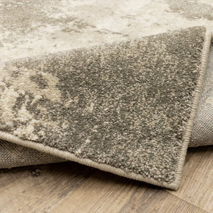 2' x 8' beige & grey abstract power loom runner rug on wood floor; stain-resistant.