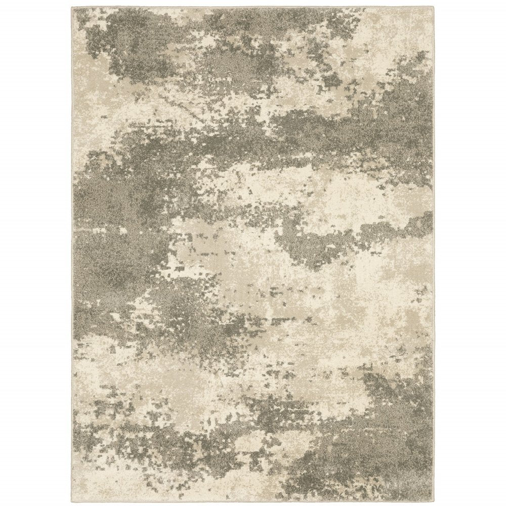 Rectangular area rug in beige and taupe with abstract cloudy blotches.