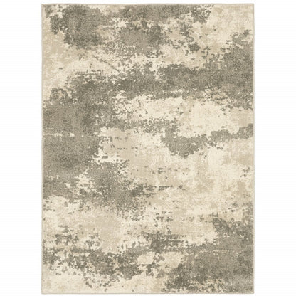 Rectangular area rug in beige and taupe with abstract cloudy blotches.