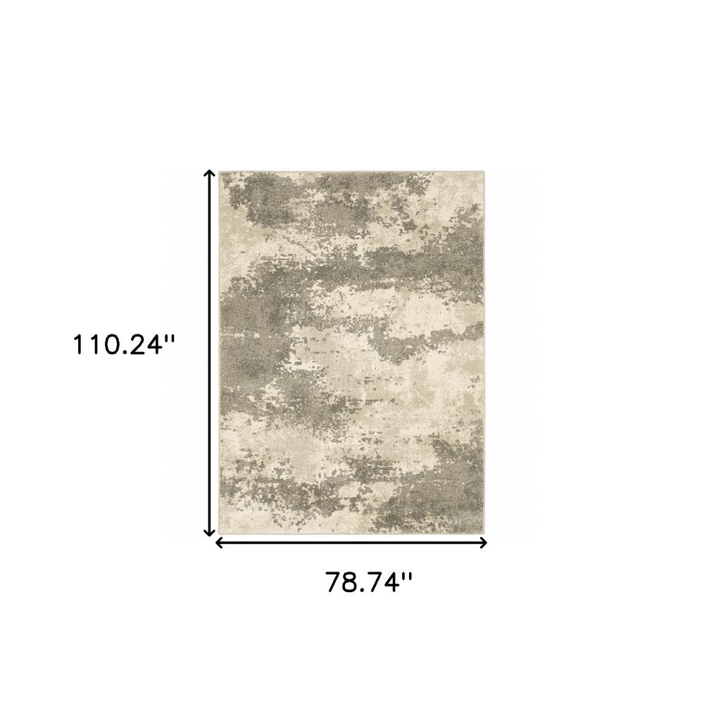7' X 9' Beige And Ivory Abstract Shag Area Rug