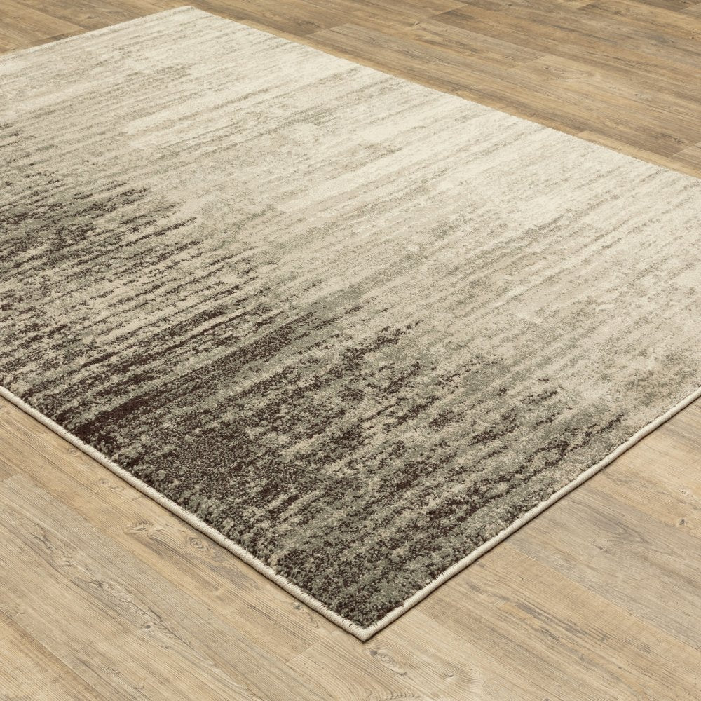 2' x 3' beige and grey abstract power loom stain resistant area rug