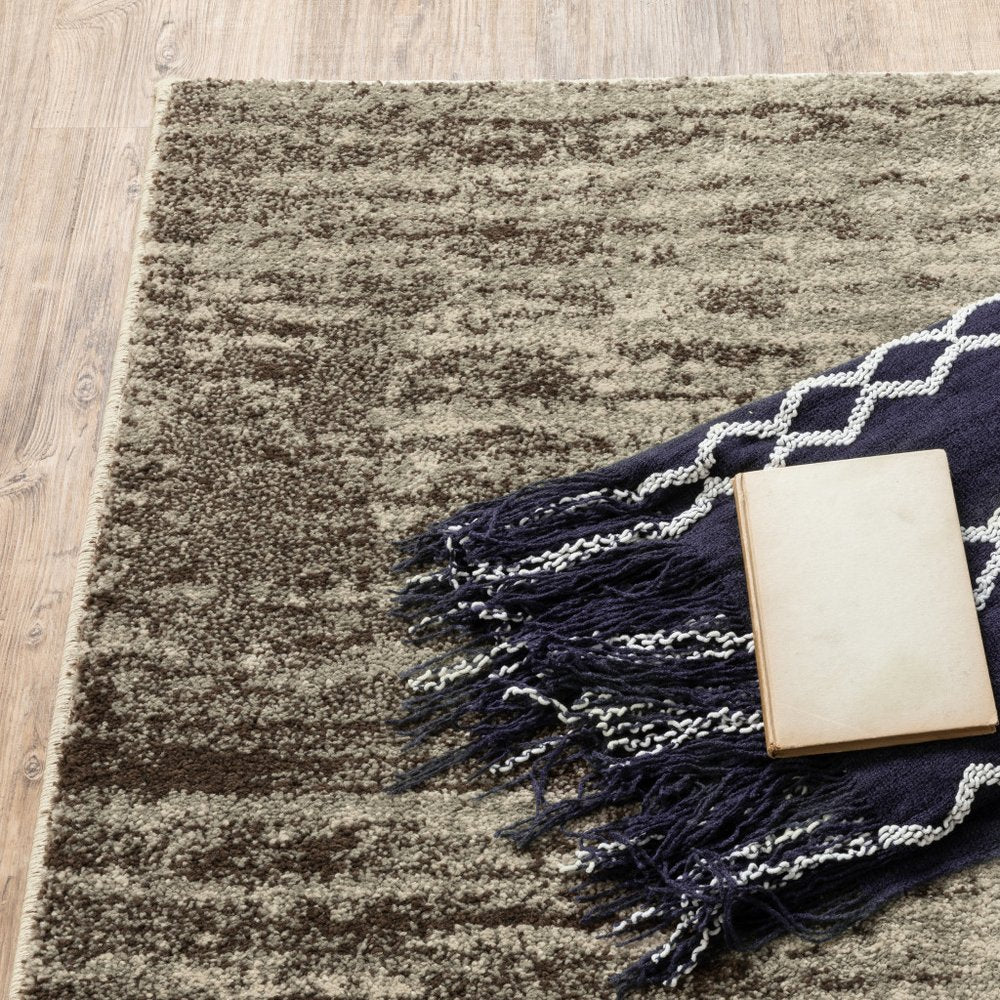 2' X 3' beige and grey abstract power loom stain resistant area rug