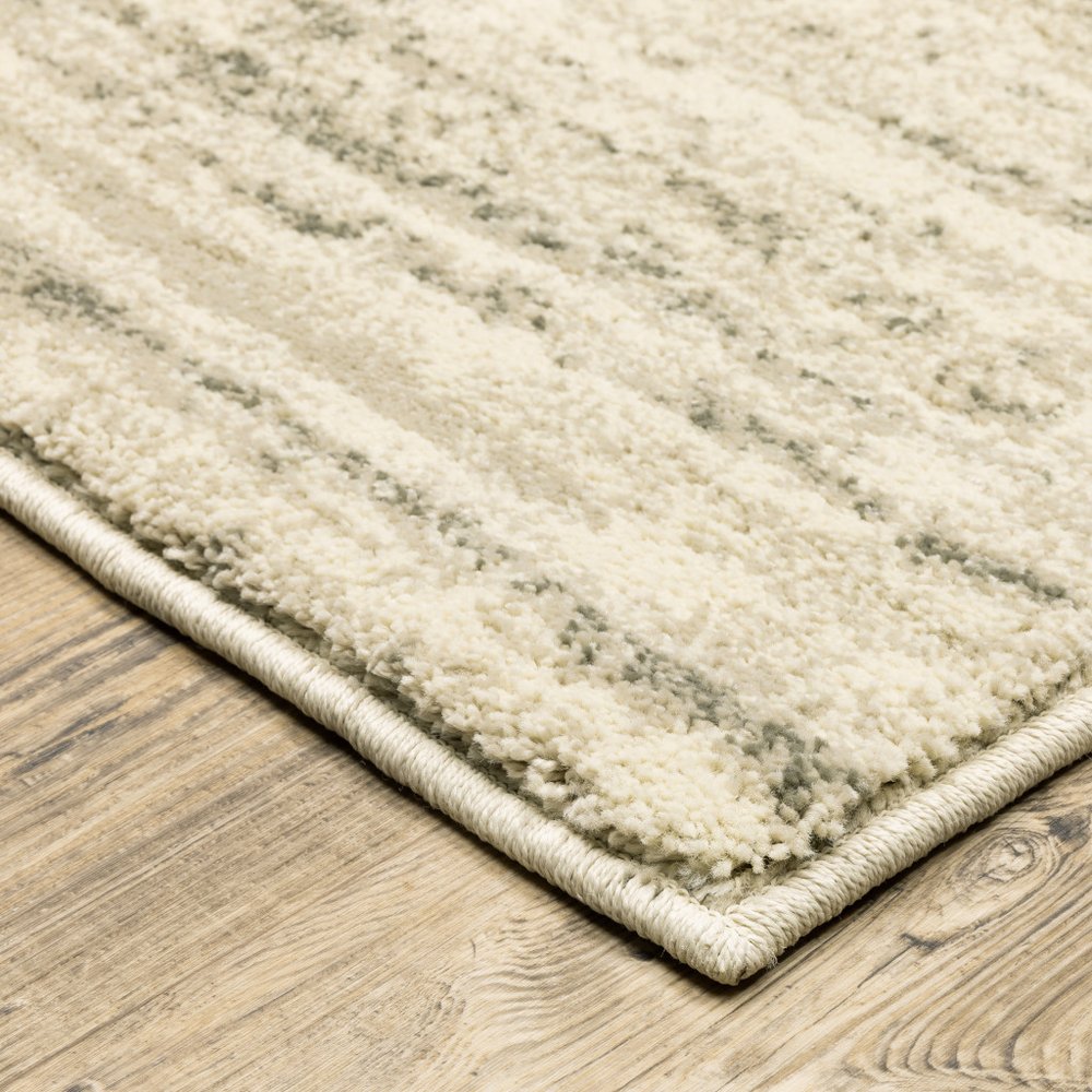 7' X 9' Beige And Ivory Abstract Shag Area Rug