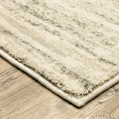 7' X 9' Beige And Ivory Abstract Shag Area Rug
