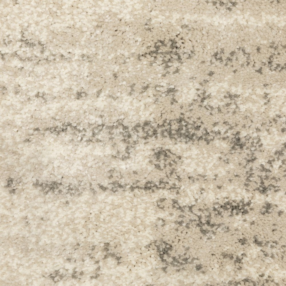 7' X 9' Beige And Ivory Abstract Shag Area Rug