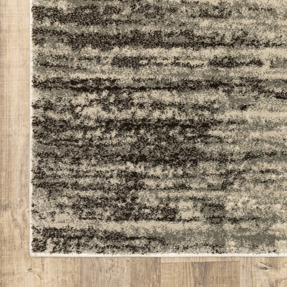 7' X 9' Beige And Ivory Abstract Shag Area Rug