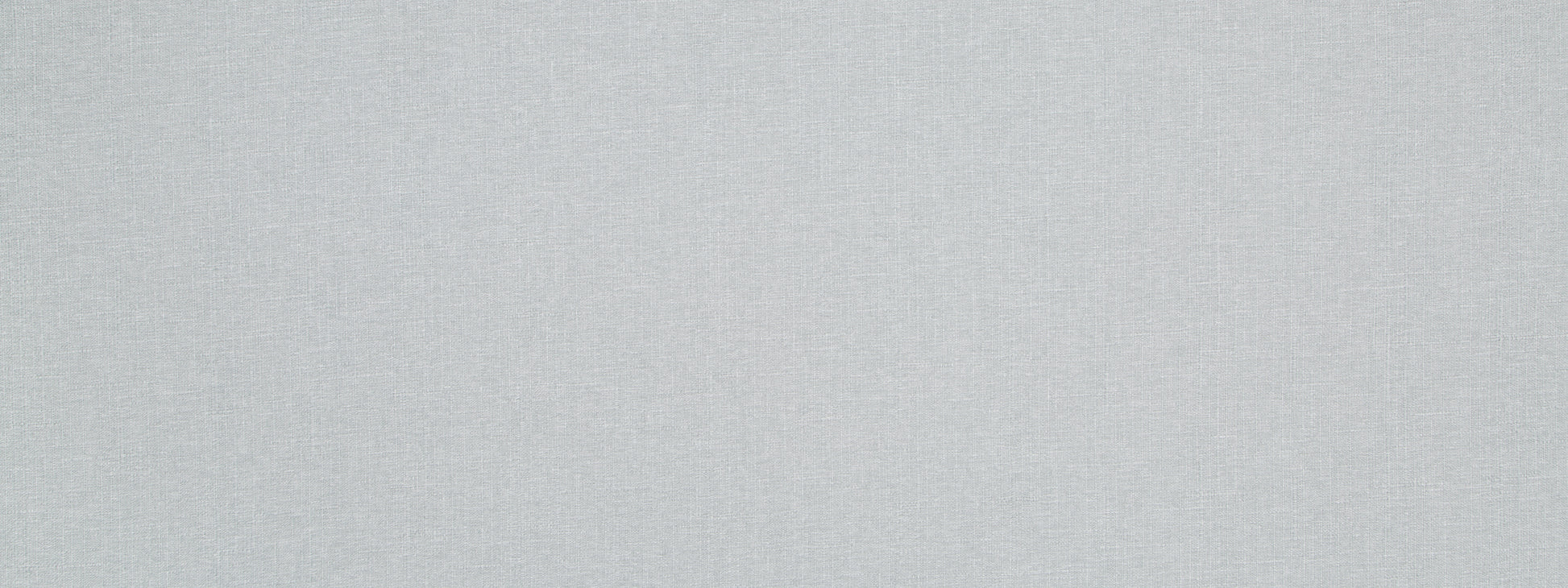 Light gray textured fabric background with subtle woven weave pattern.