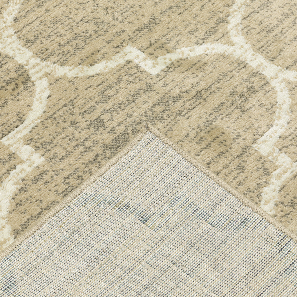 6' X 9' Beige And Ivory Geometric Power Loom Stain Resistant Area Rug