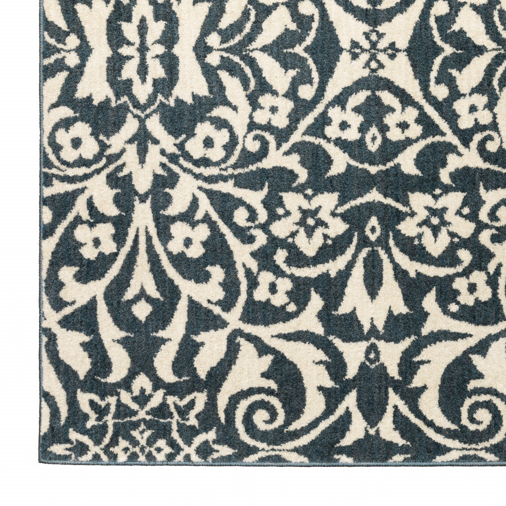 5' X 7' Blue And Ivory Floral Power Loom Stain Resistant Area Rug