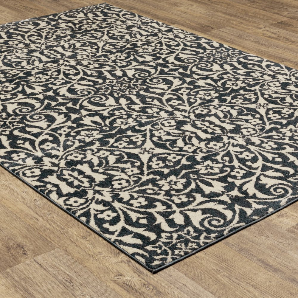 10' X 13' Blue And Ivory Floral Power Loom Stain Resistant Area Rug