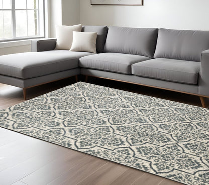 10' X 13' Ivory Blue And Sage Floral Power Loom Stain Resistant Area Rug