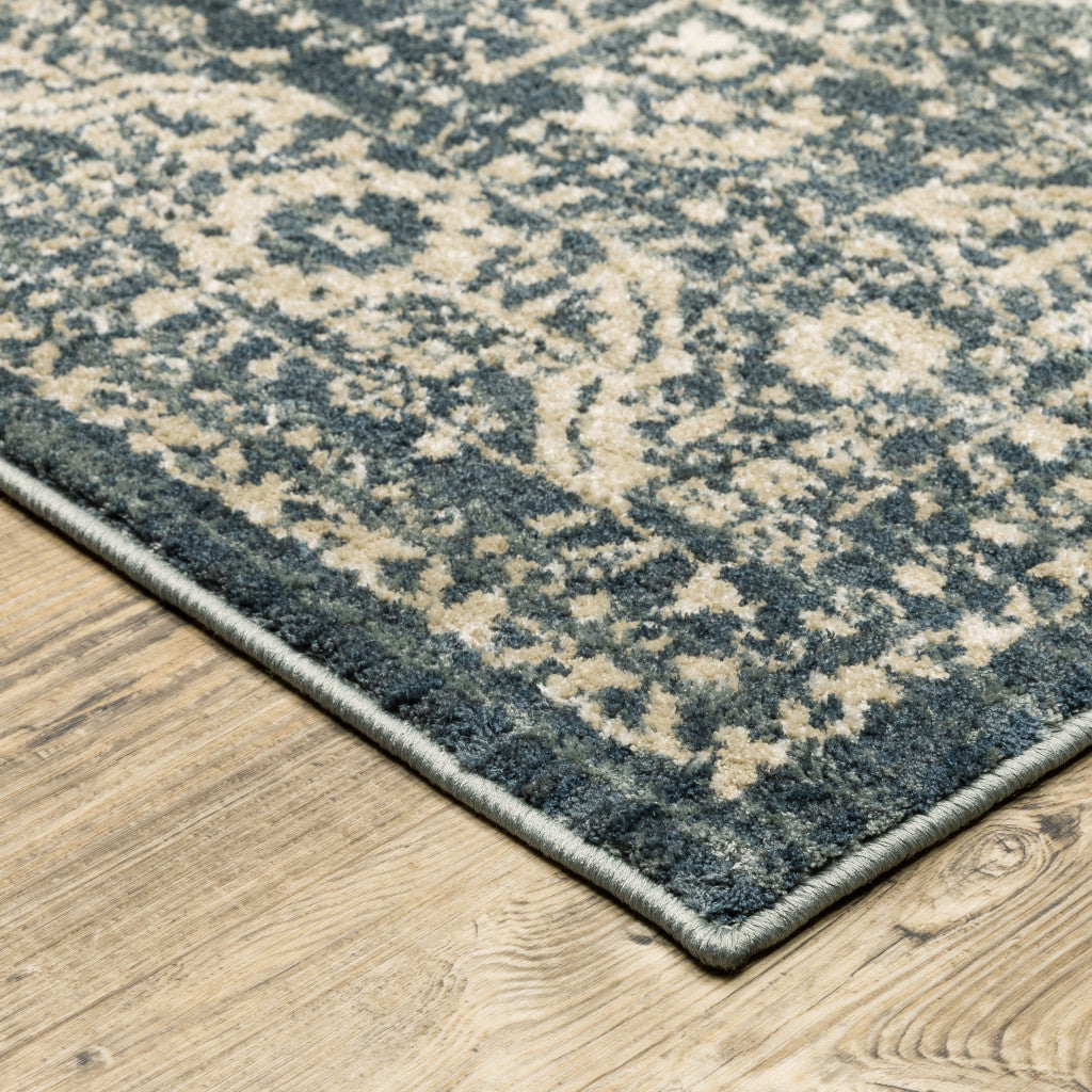 6' X 9' Beige Grey And Blue Oriental Power Loom Stain Resistant Area Rug