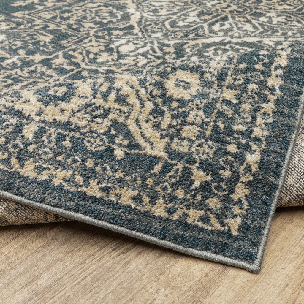 6' X 9' Beige Grey And Blue Oriental Power Loom Stain Resistant Area Rug