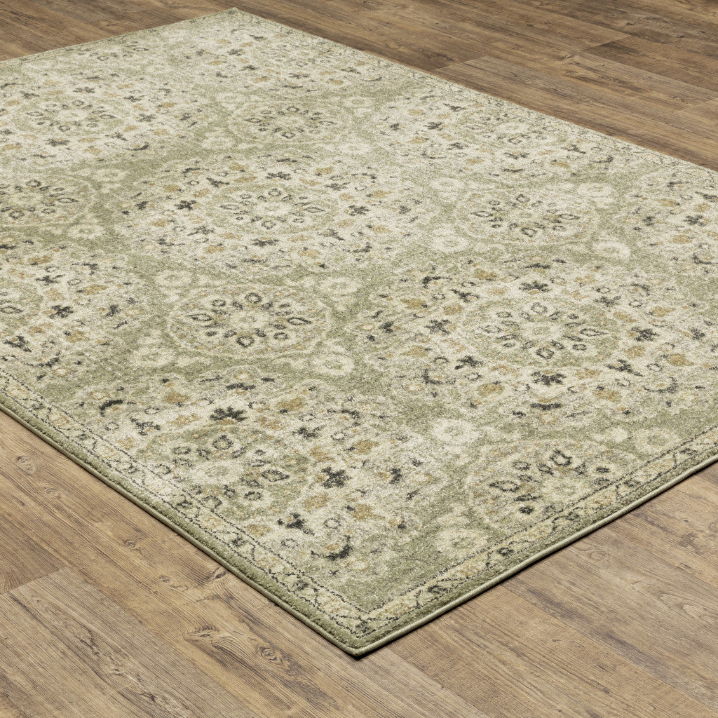 5' X 8' Green Ivory Grey And Tan Floral Power Loom Stain Resistant Area Rug