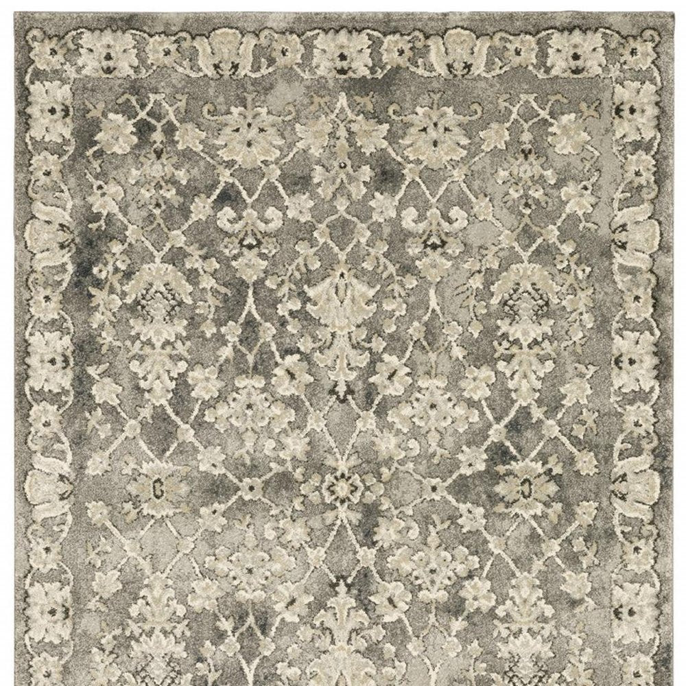 6' X 9' Grey Beige Tan And Brown Oriental Power Loom Stain Resistant Area Rug