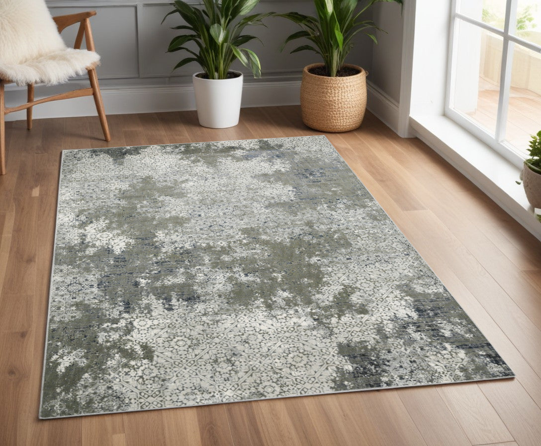 4' X 6' Ivory Grey Blue And Taupe Abstract Power Loom Stain Resistant Area Rug