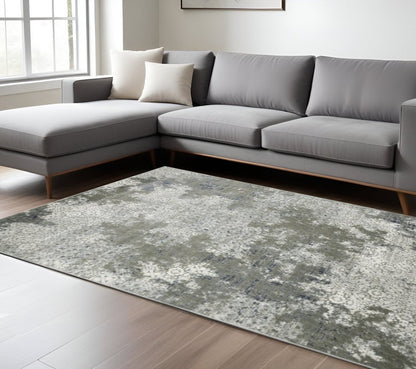 10' x 13' ivory, grey, blue & taupe abstract power loom stain-resistant area rug