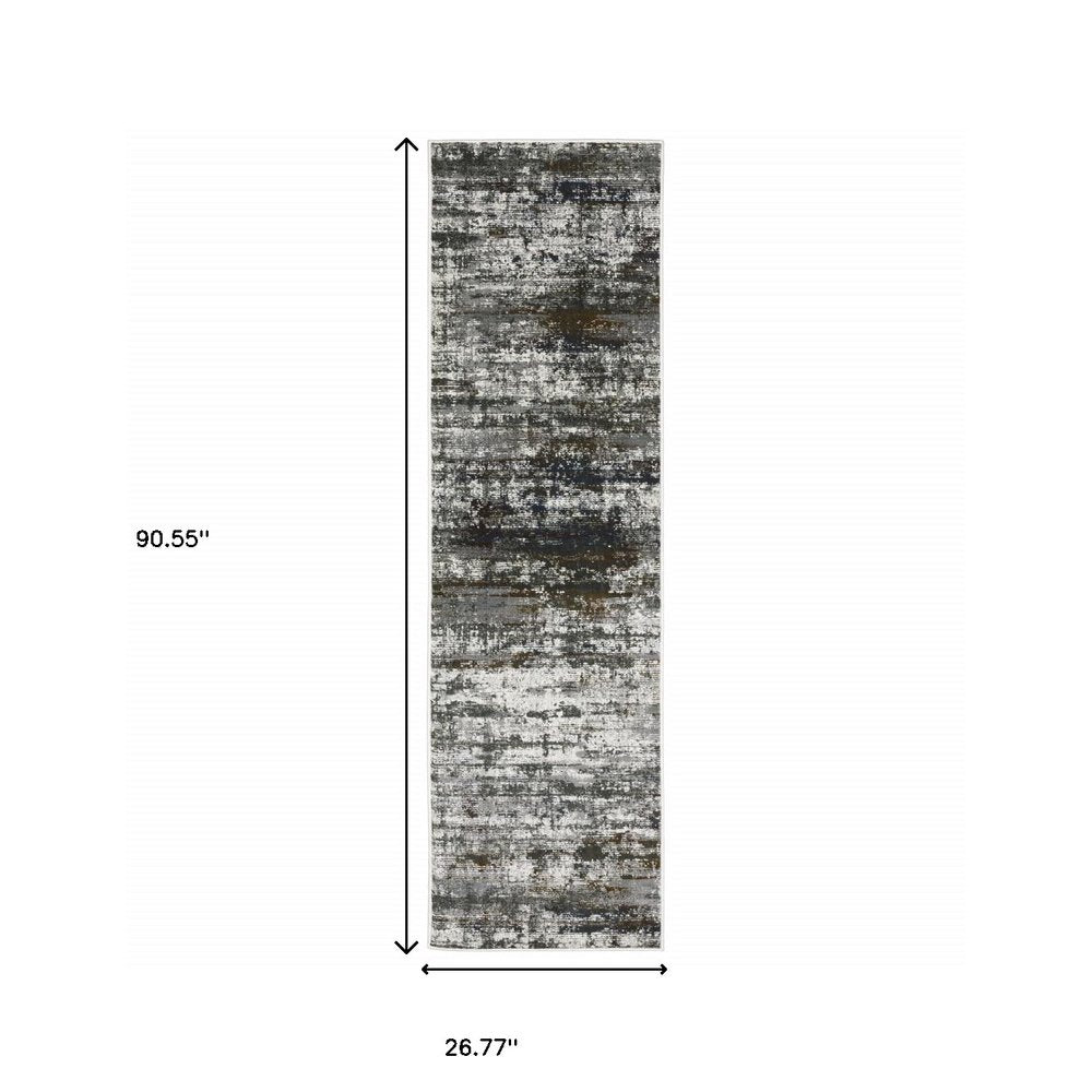 2' x 8' runner rug in ivory, charcoal grey, blue, rust and brown with an abstract power-loom design; stain resistant.