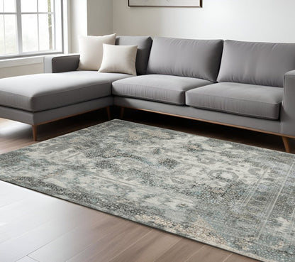 8' X 11' Ivory Grey Charcoal Blue And Rust Oriental Power Loom Stain Resistant Area Rug