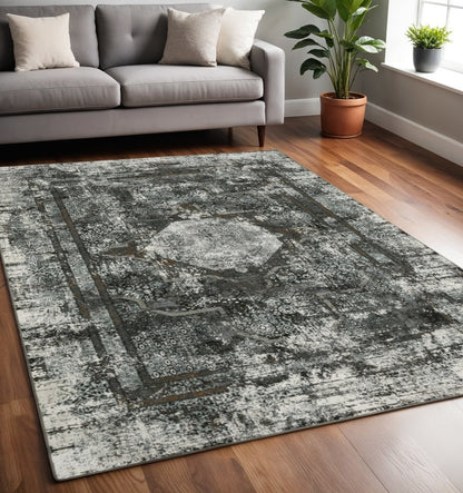 5' x 8' charcoal and gray oriental distressed area rug.