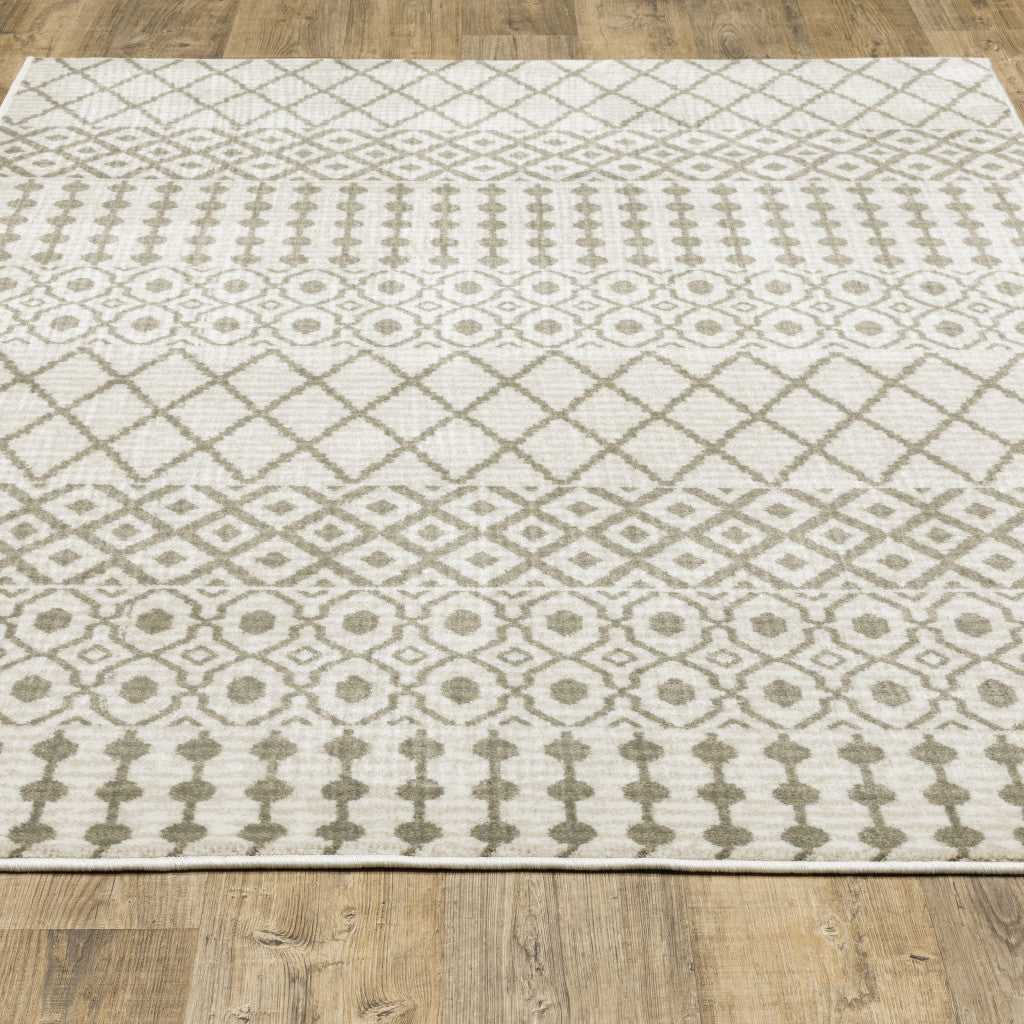 5' X 7' Ivory And Grey Geometric Power Loom Stain Resistant Area Rug