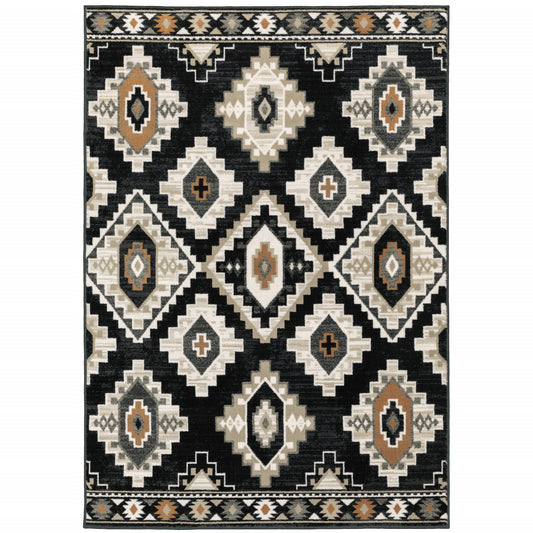 4' X 6' Black Grey Tan Orange And Ivory Southwestern Power Loom Stain Resistant Area Rug