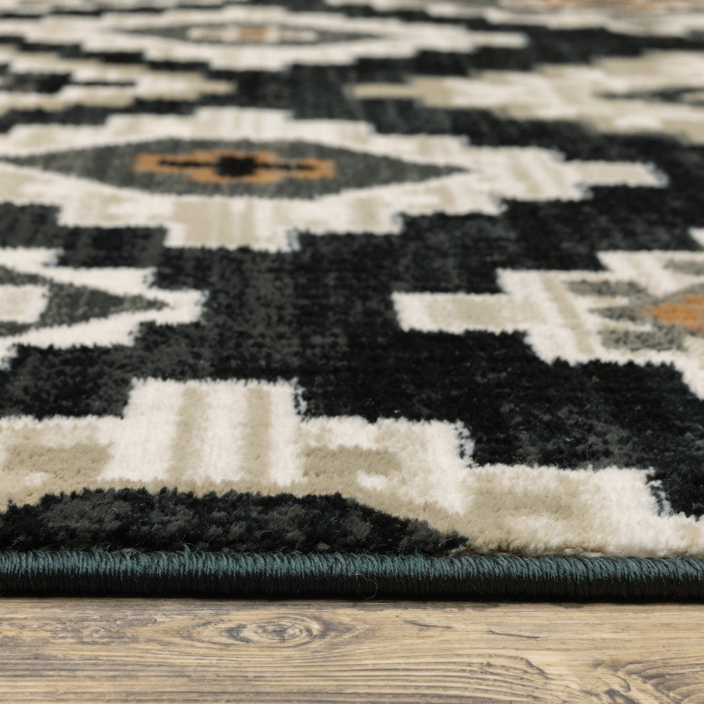 4' X 6' Black Grey Tan Orange And Ivory Southwestern Power Loom Stain Resistant Area Rug