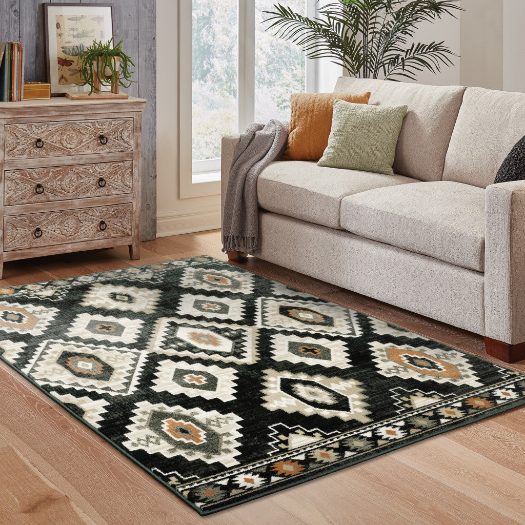 6' X 9' Black Grey Tan Orange And Ivory Southwestern Power Loom Stain Resistant Area Rug