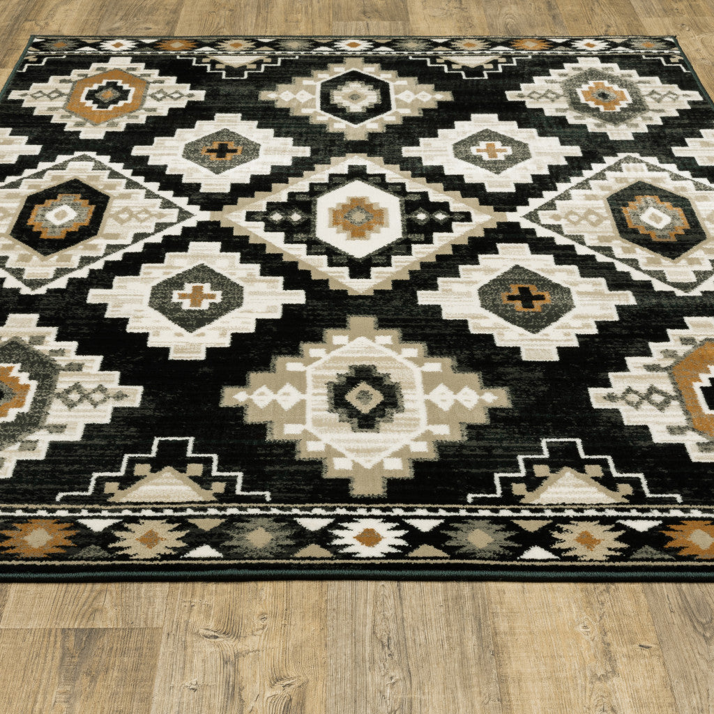 10' X 13' Black Grey Tan Orange And Ivory Southwestern Power Loom Stain Resistant Area Rug