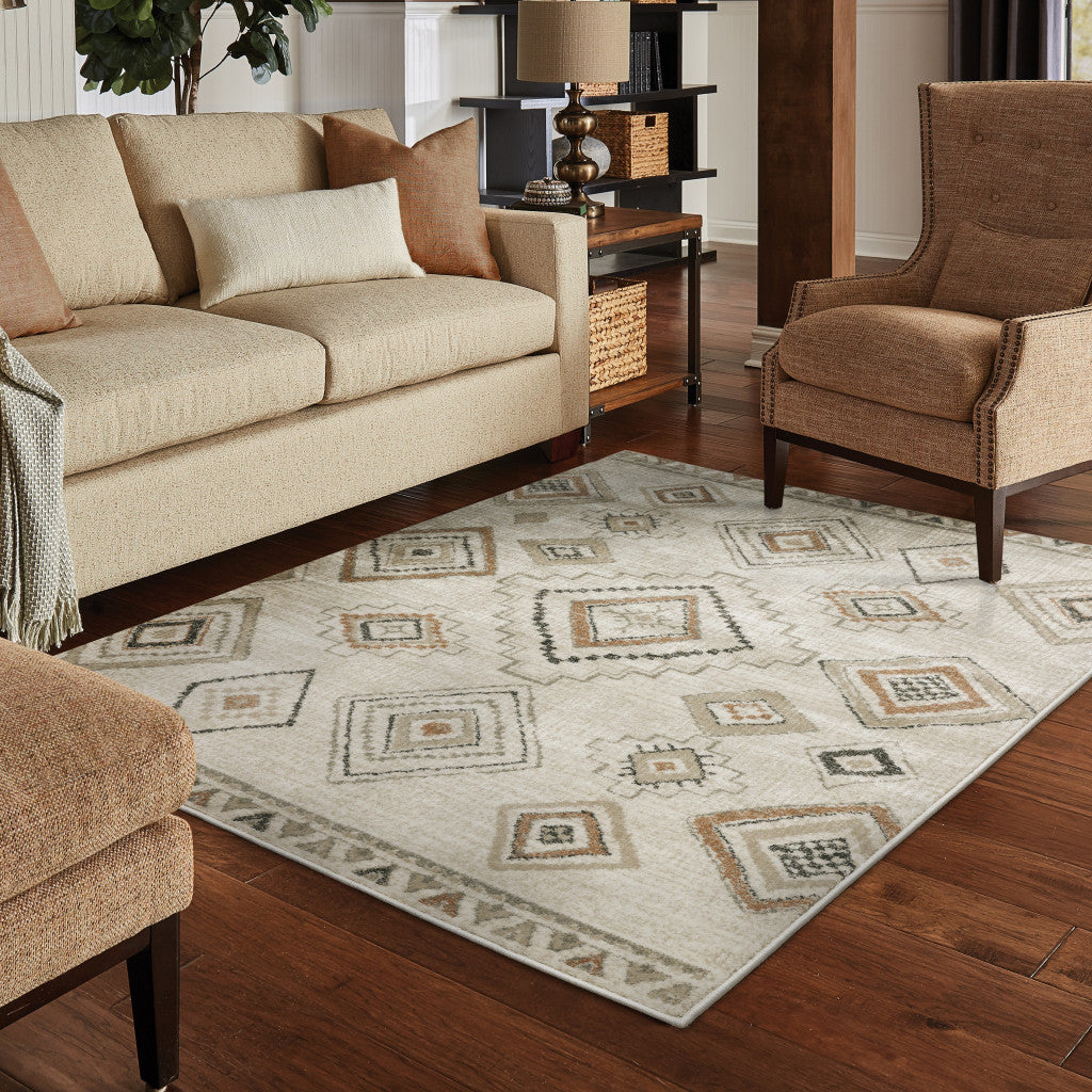 5' X 7' Ivory Orange Tan Black And Grey Southwestern Power Loom Stain Resistant Area Rug