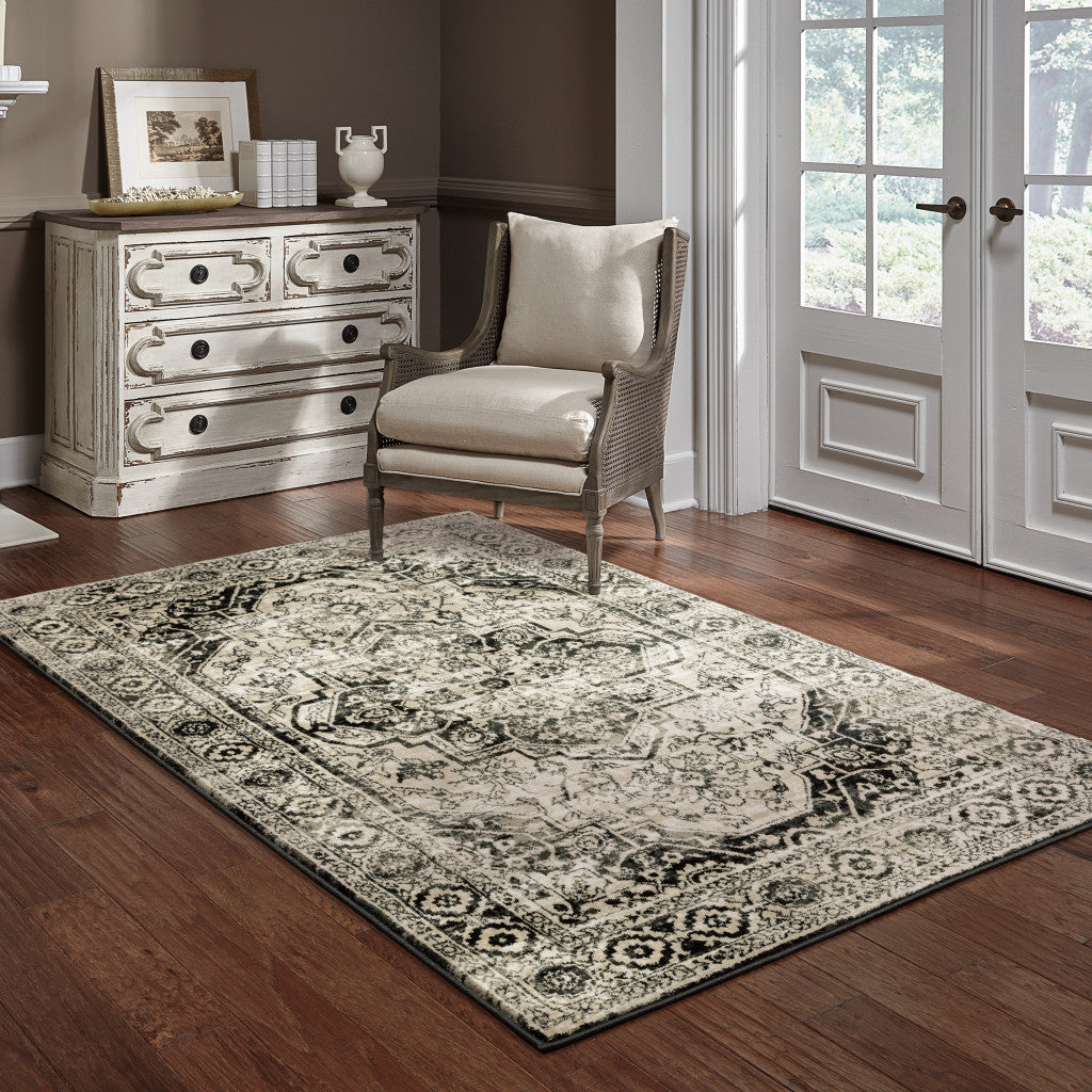 4' X 6' Black Grey Tan And Ivory Oriental Power Loom Stain Resistant Area Rug