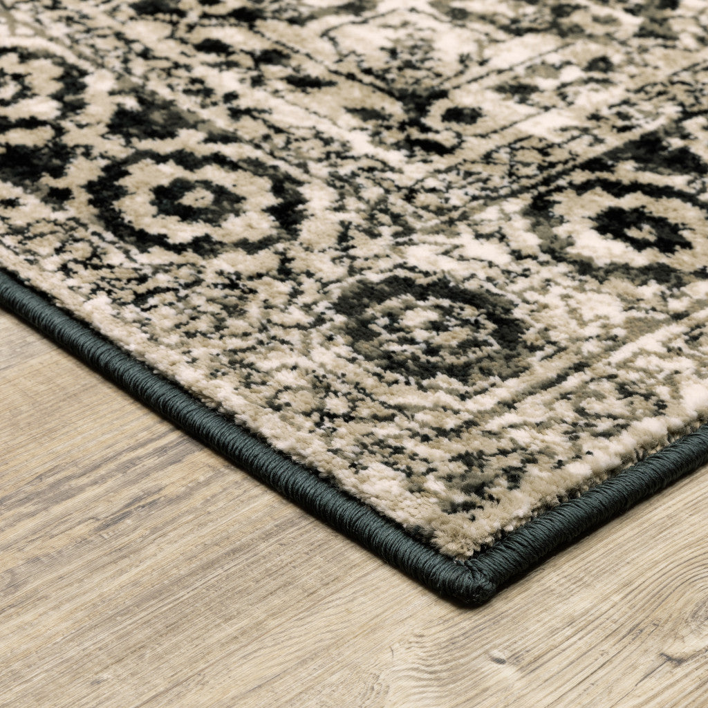 5' X 7' Black Grey Tan And Ivory Oriental Power Loom Stain Resistant Area Rug