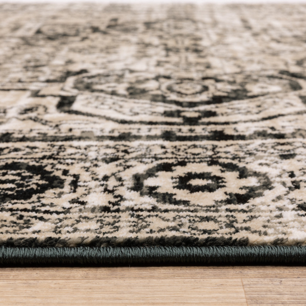 5' X 7' Black Grey Tan And Ivory Oriental Power Loom Stain Resistant Area Rug