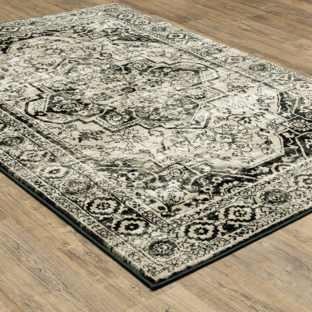 5' X 7' Black Grey Tan And Ivory Oriental Power Loom Stain Resistant Area Rug