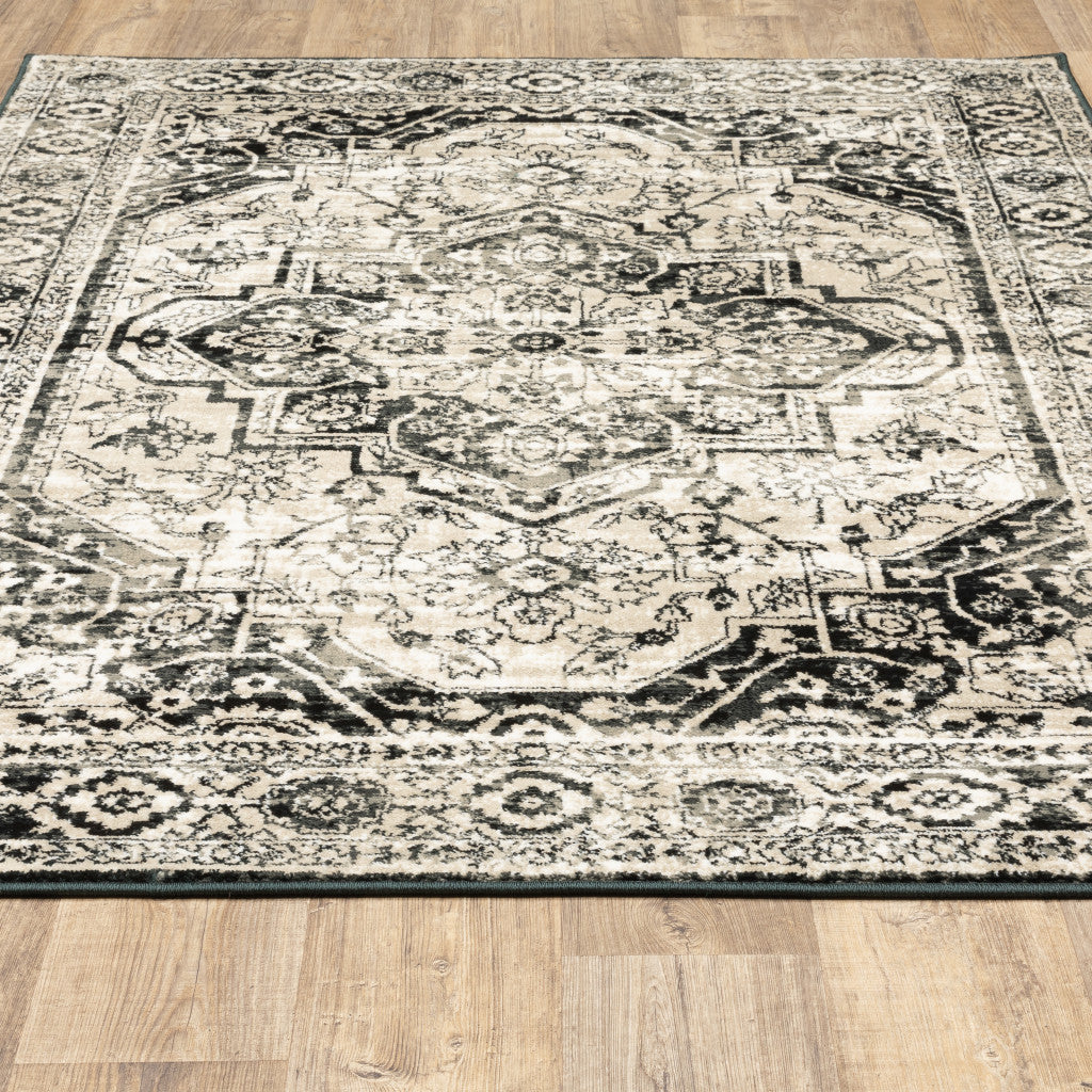 5' X 7' Black Grey Tan And Ivory Oriental Power Loom Stain Resistant Area Rug