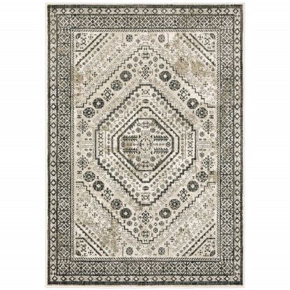 Rectangular vintage-inspired area rug in ivory, beige and charcoal with diamond medallion center and geometric borders.