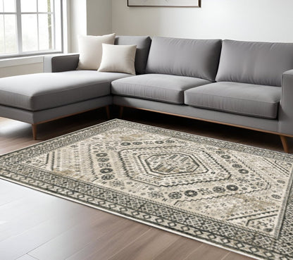 8' x 10' ivory, grey & black Oriental power loom stain-resistant area rug.