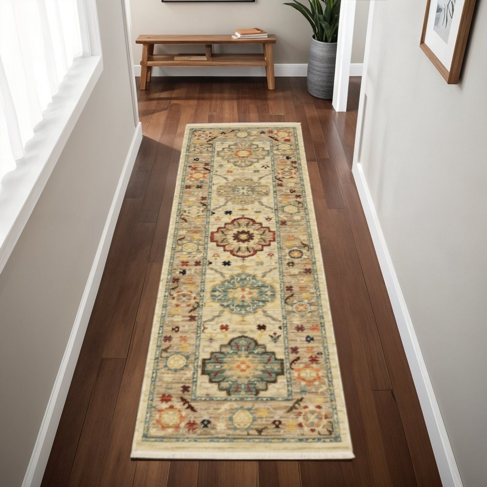 2' X 6' Beige Pale Blue Rust Gold Tan Brown And Orange Oriental Power Loom Stain Resistant Runner Rug With Fringe