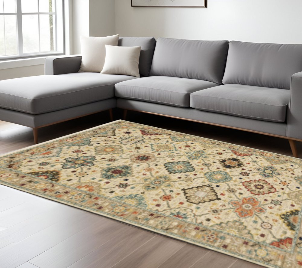 8' X 11' Beige Pale Blue Rust Gold Tan Brown And Orange Oriental Power Loom Stain Resistant Area Rug With Fringe